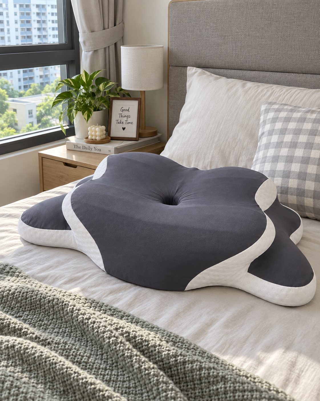 Big Ear Pillow shown close up on a neatly styled bed